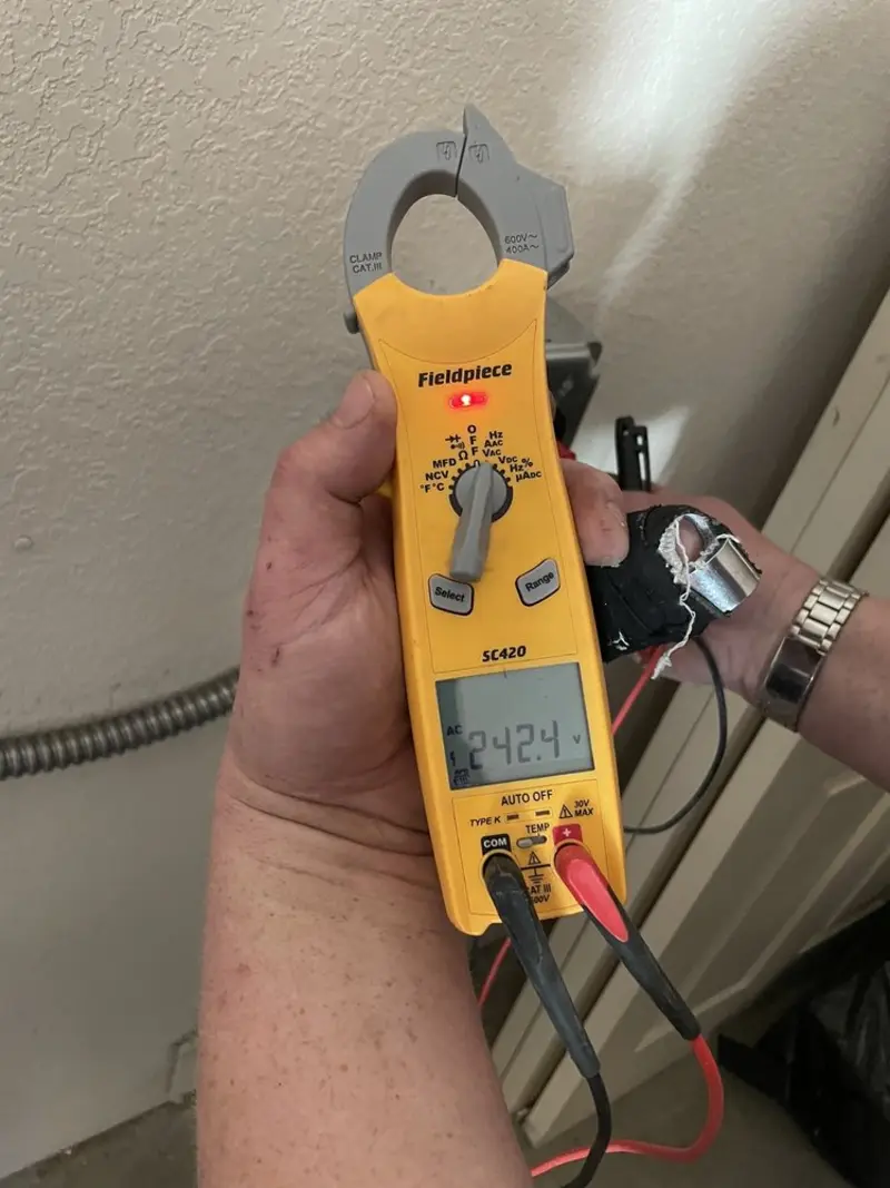 Voltage testing with clamp meter during Generator Installation in Coopersville